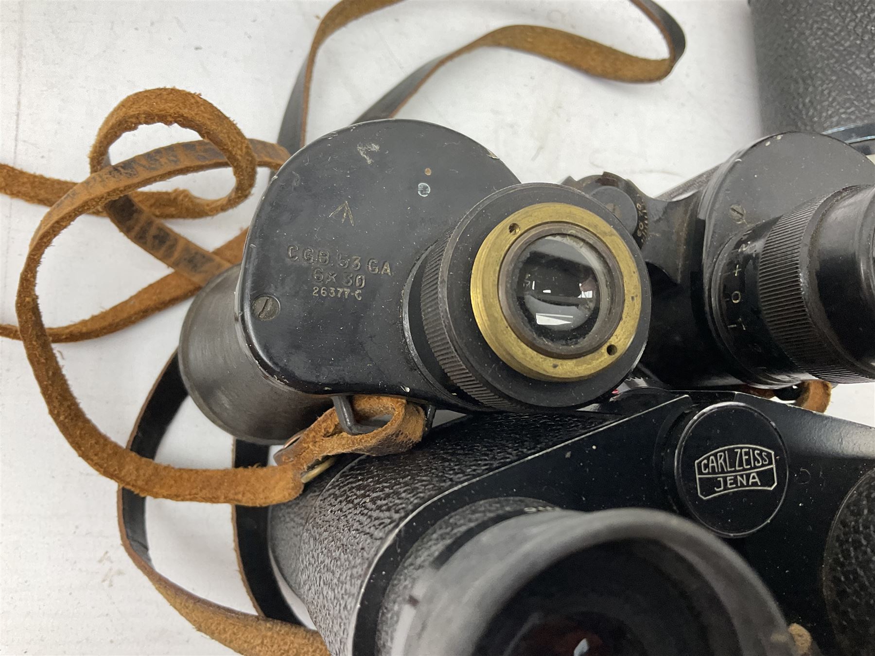 Twelve pairs of binoculars to include BWCF 7x35 Extra Wide Angle, Carl Zeiss Jena Delturis 8x24, Carl Zeiss Jena Jenoptem 8x30W, Chinon Countryman 10x50,  Ajax 8x30, Regent 16x50, etc,  some with cases