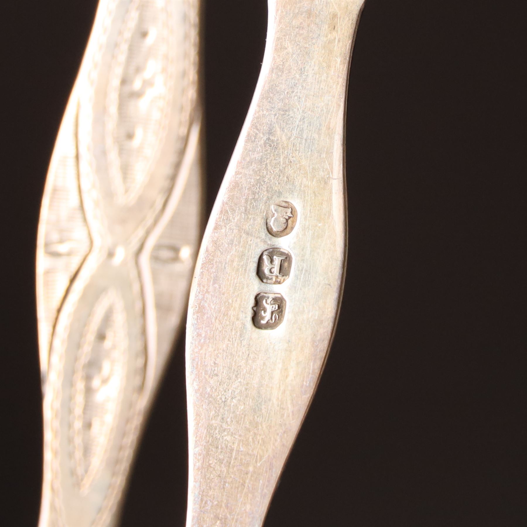 Early 19th century silver caddy spoon, Elizabeth II caddy spoon, various silver condiment spoons, sugar tongs, napkin ring, other silver cutlery and a silver paper knife, boxed