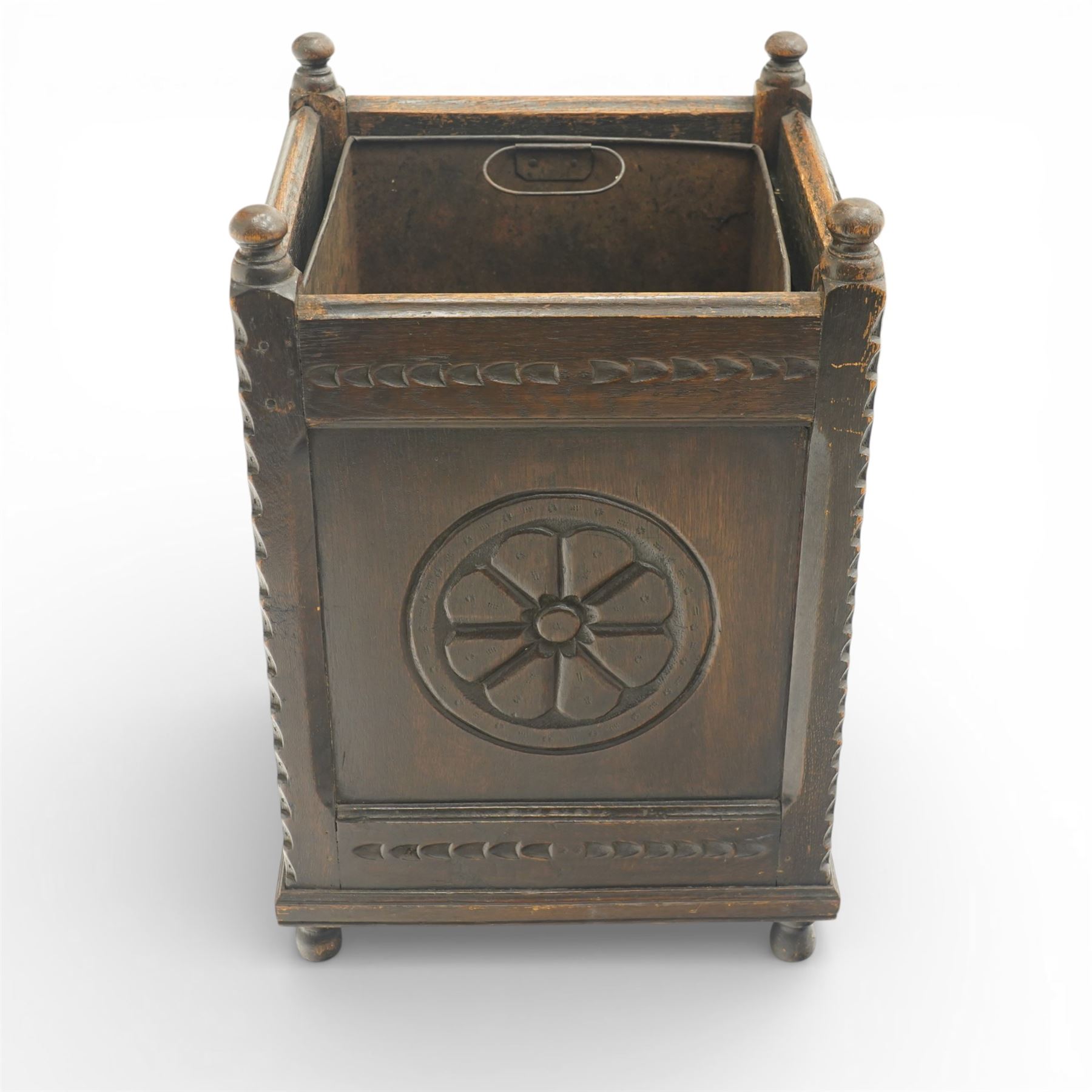 20th century carved fireside accessories; a carved coal bucket with metal liner and a carved fire screen