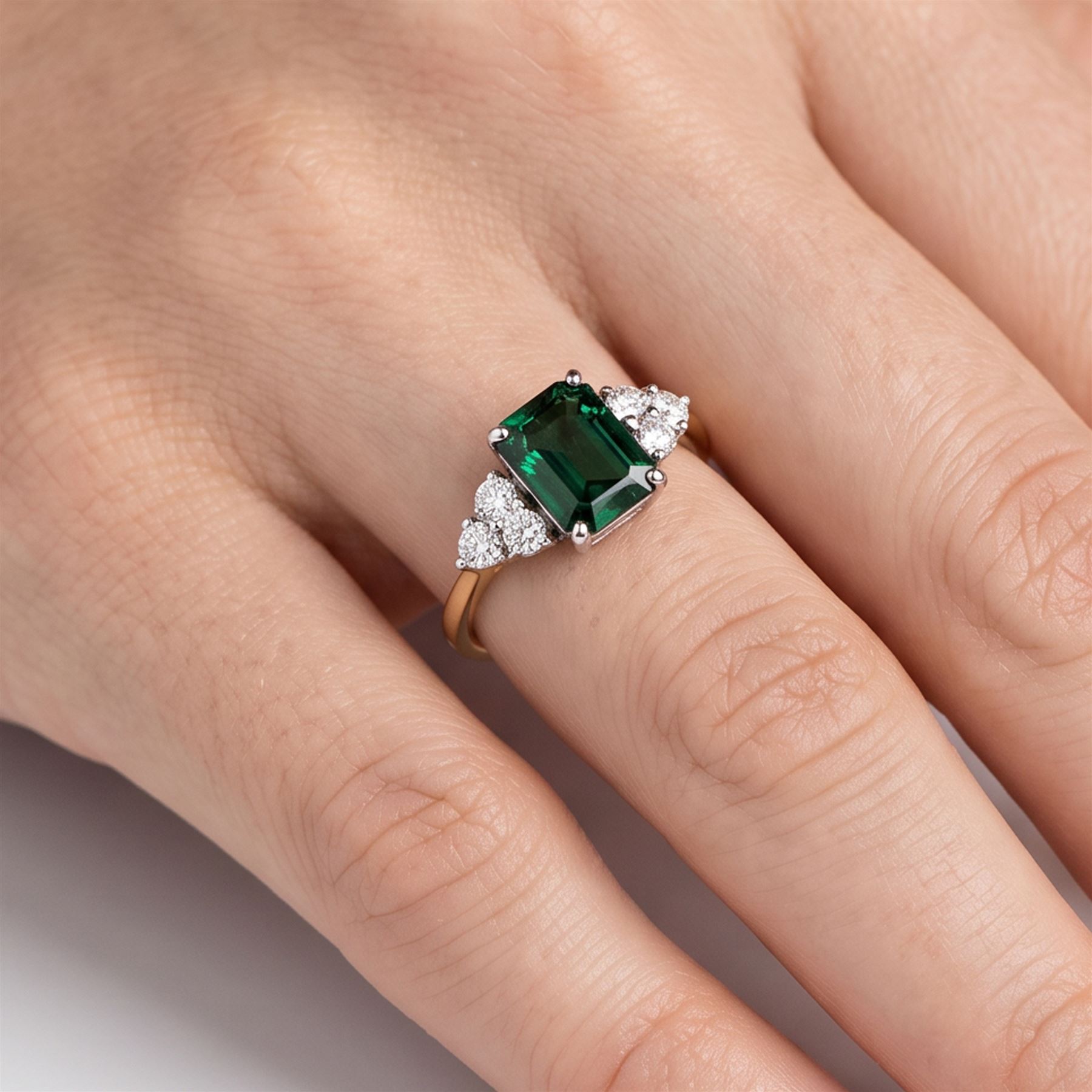 18ct gold green tourmaline and diamond ring, single octagonal cut tourmaline of approx 2.15 carat, with three round brilliant cut diamonds set either side, total diamond weight approx 0.30 carat