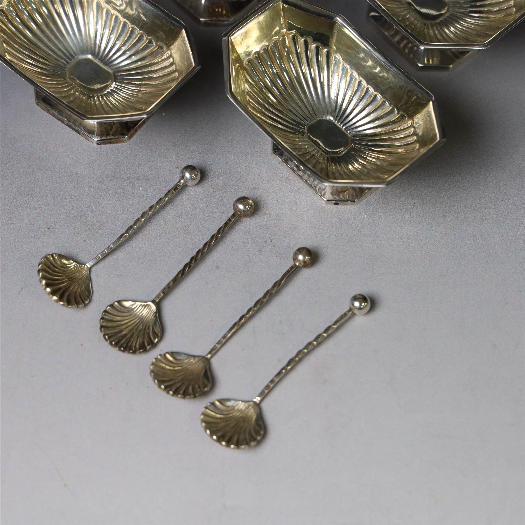 Set of four late Victorian silver open salts, of octagonal part fluted form, with four clam shell spoons, hallmarked Colen Hewer Cheshire, Birmingham 1896, salts H4cm, contained within fitted case