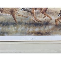 Robert E Fuller (British 1972-): 'Hares on the Run', limited edition print signed titled and numbered 250/550, 34.5cm x 93cm 