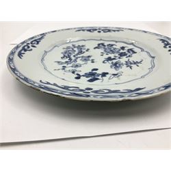 Set of four late 18th/early 19th century Chinese export blue and white plates, each of circular form, decorated with blossoming flowers, within shaped, and trellis borders, D22.5cm