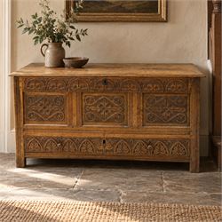 18th century carved oak coffer, rectangular hinged top over a lunette-carved frieze and tr...