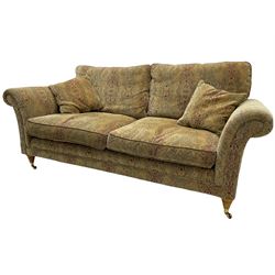 Parker Knoll two seat sofa, upholstered in natural beige patterned fabric