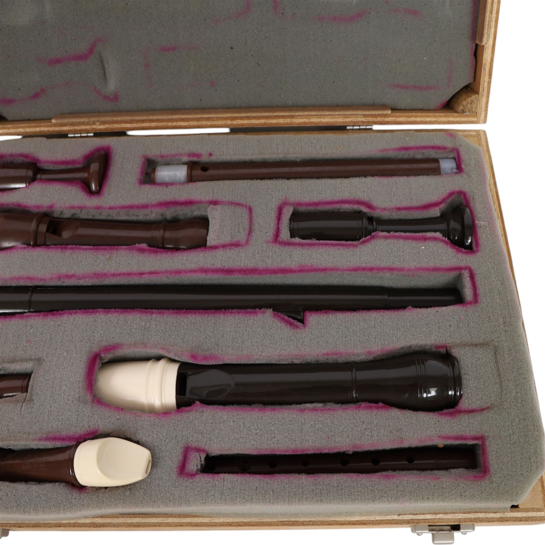 Three Dolmetsch recorders, comprising Dolmetsch International Tenor recorder, Dolmetsch Dolonite Treble recorder and a Dolmetsch International Descant recorder, all contained in a matched wooden case