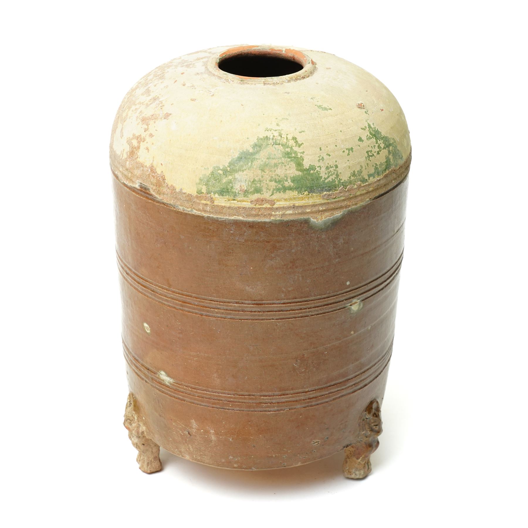 Chinese Han dynasty (202BC-9AD) brown glazed grain store, of cylindrical form, the feet formed as lions,  H26cm