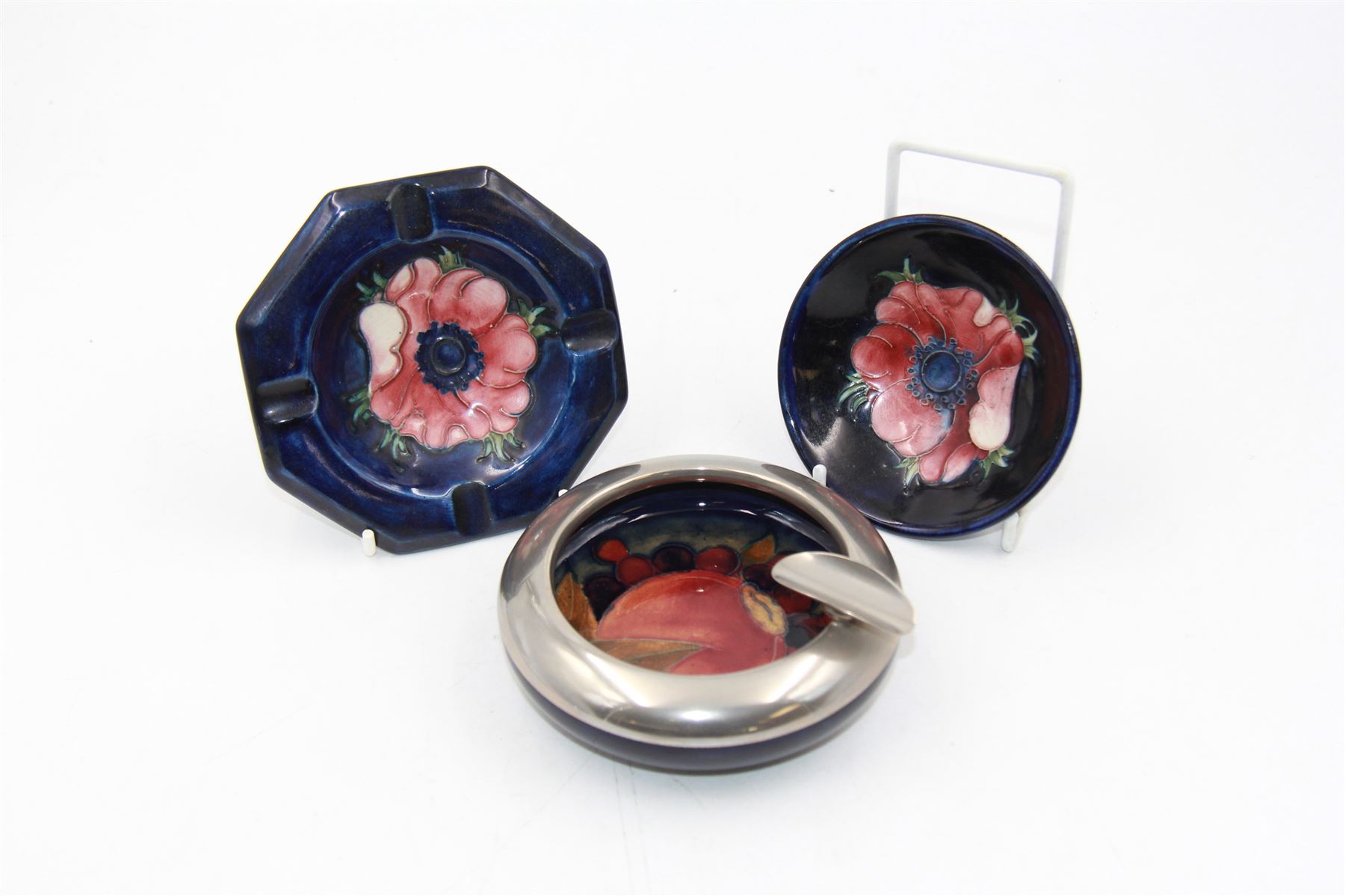 Moorcroft pewter-mounted circular ashtray decorated in Pomegranate pattern, together with Anemone pattern ashtray and trinket dish, all with makers mark beneath    