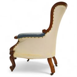 Fine pair of mid-19th-century mahogany library armchairs, carved frame with balloon-shaped back with scrolled ends, rolled wide arms, ending in a scrolled volute above a serpentine seat rail, upholstered in mottled turquoise faux leather, button upholstered back, arms, and cushion seat, studded sides and apron, raised on scroll carved front feet and splayed rear legs on castors 