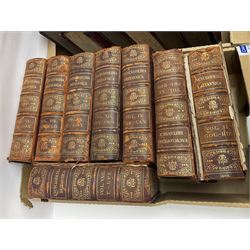Thirty six volumes of Encyclopaedia Britannica with gold tooled red leather spines in various editions 