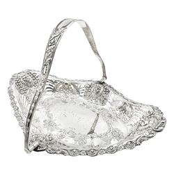 Edwardian silver swing handled basket, of navette form, with four repousse lion masks to each corner and with pierced and embossed floral, scroll and shell decoration to sides, base and handle, hallmarked Charles Horner, Birmingham 1906, height including handle H20cm