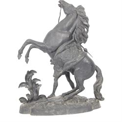 Three spelter Marley Horse figures, after Guillaume Coustou, each modelled as a rearing horse restrained by  groom, tallest H41cm