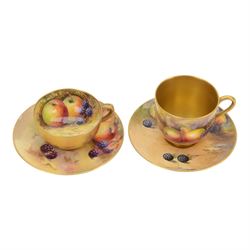 Two Royal Worcester fruit painted miniature cabinet cups and saucers, the first example in...