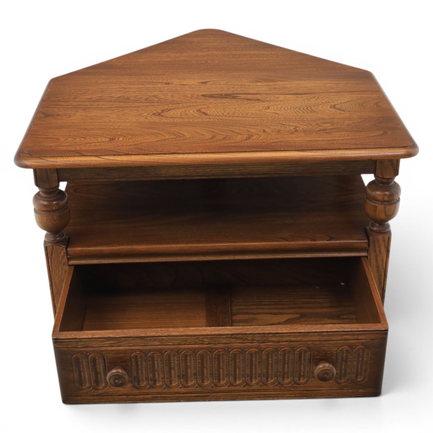Ercol -  dark elm corner TV stand and coffee table, TV stand with drop triangular leaf, over open recess above a single drawer (H 47cm, D 44cm with leaf 79cm, W 73cm,  the coffee table with chamfered rectangular top with full length undertier, raised on turned supports (H 43cm, D 54cm, W 115cm) 