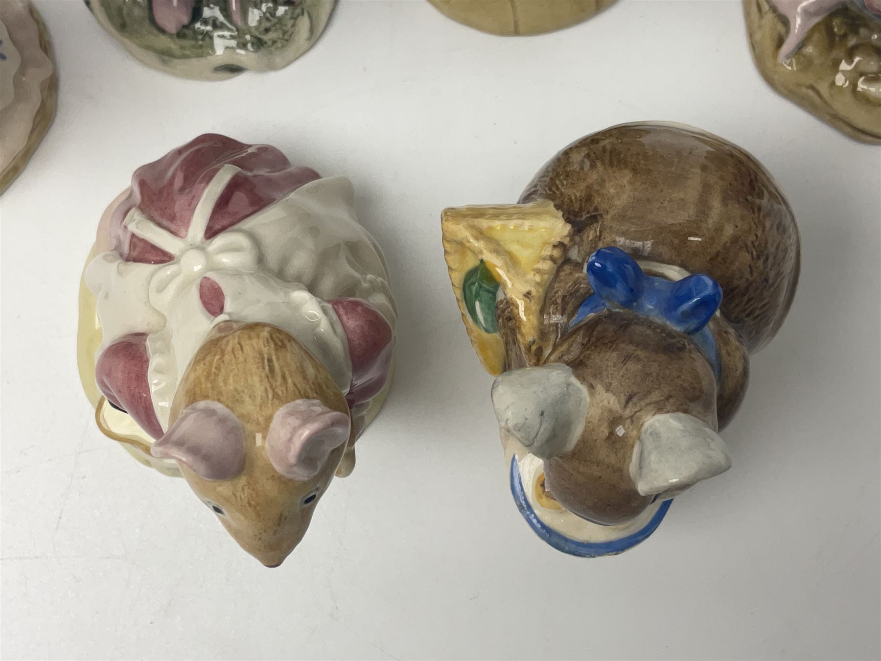 Five Royal Doulton Beatrix Potter figures, comprising Poppy Eyebright, Clover, Lord Woodmouse, Mr Apple and Dusty Dogwood, together with Beswick Appley Dapply figure and three Crummles Beatrix Potter enamel pill boxes