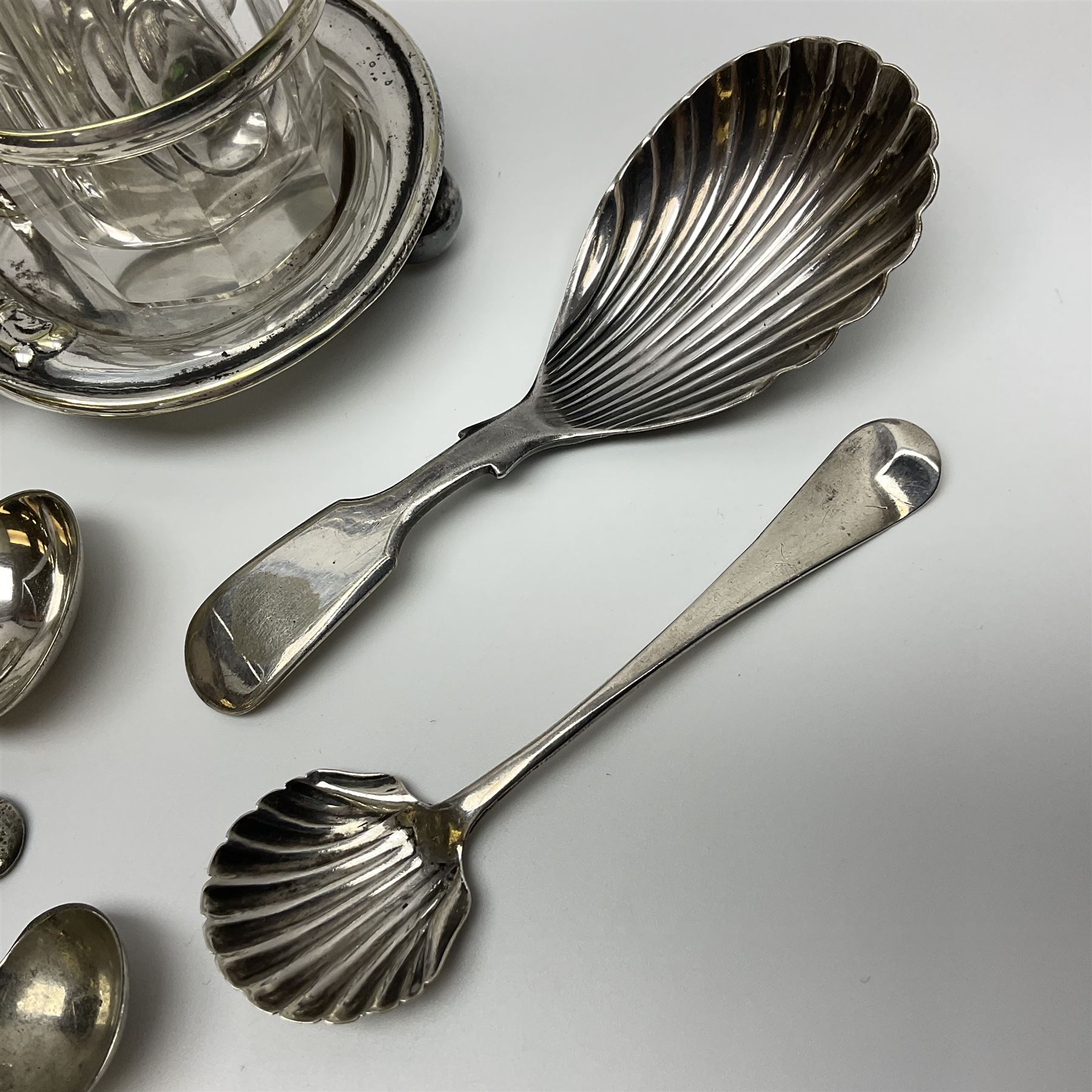 Sheffield silver-plated cruet set, comprising mustard pot, open glass salt and pepper pot on stand, together with a collection of silver plated spoons