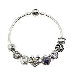 Pandora silver charm bracelet with a Disney Minnie Mouse charm and seven other Pandora charms, all stamped S925 ALE