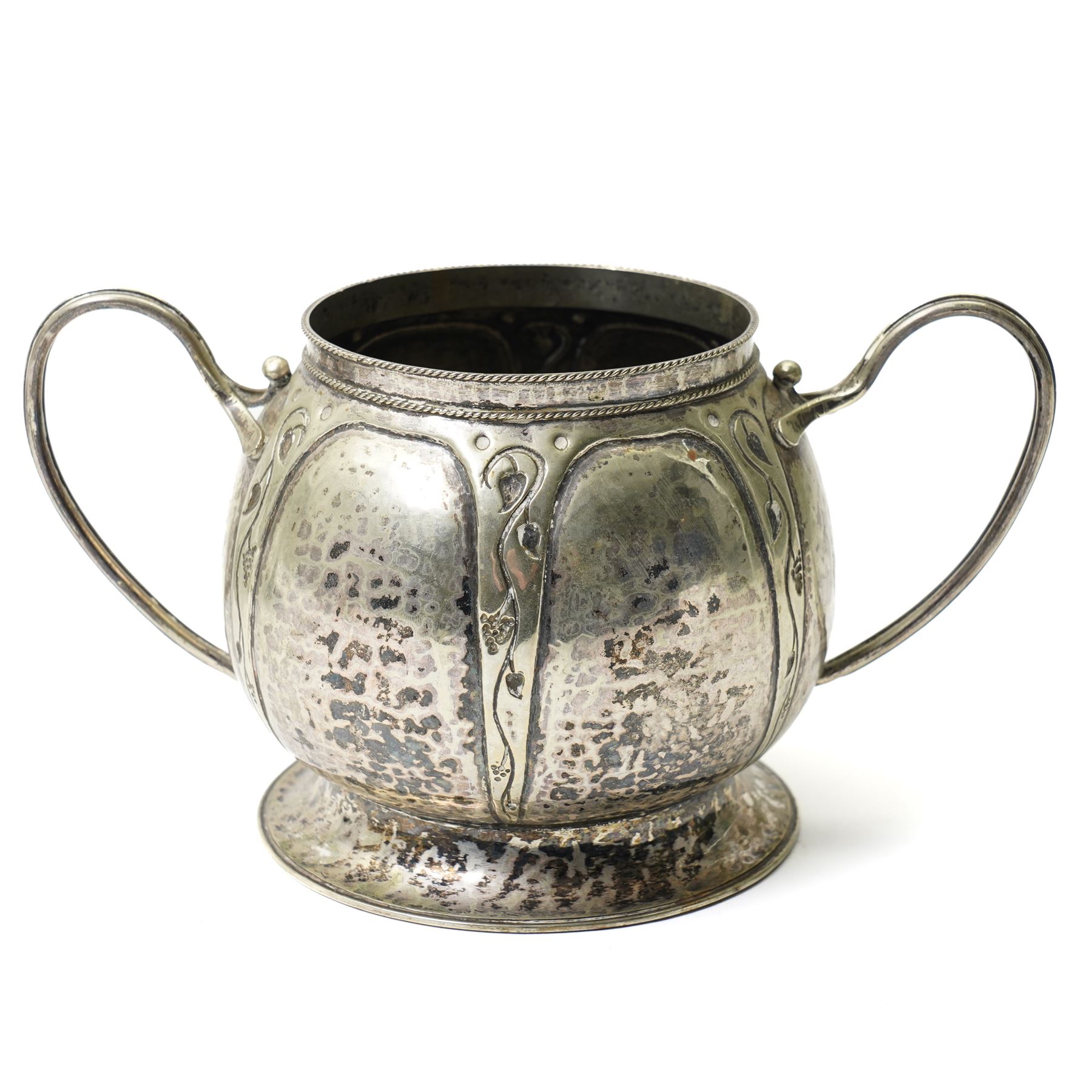 Early 20th century Arts & Crafts fruit dish by Walter Somerfield of the Leicester Art School, H16.5cm; silver plated tea service with trailing floral decoration, and various other hammered pewter items (8)