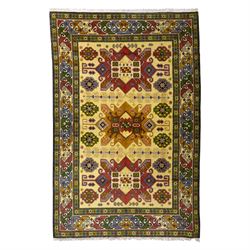 Caucasian Kazak design wool rug, cream field with three large geometric medallions and sty...