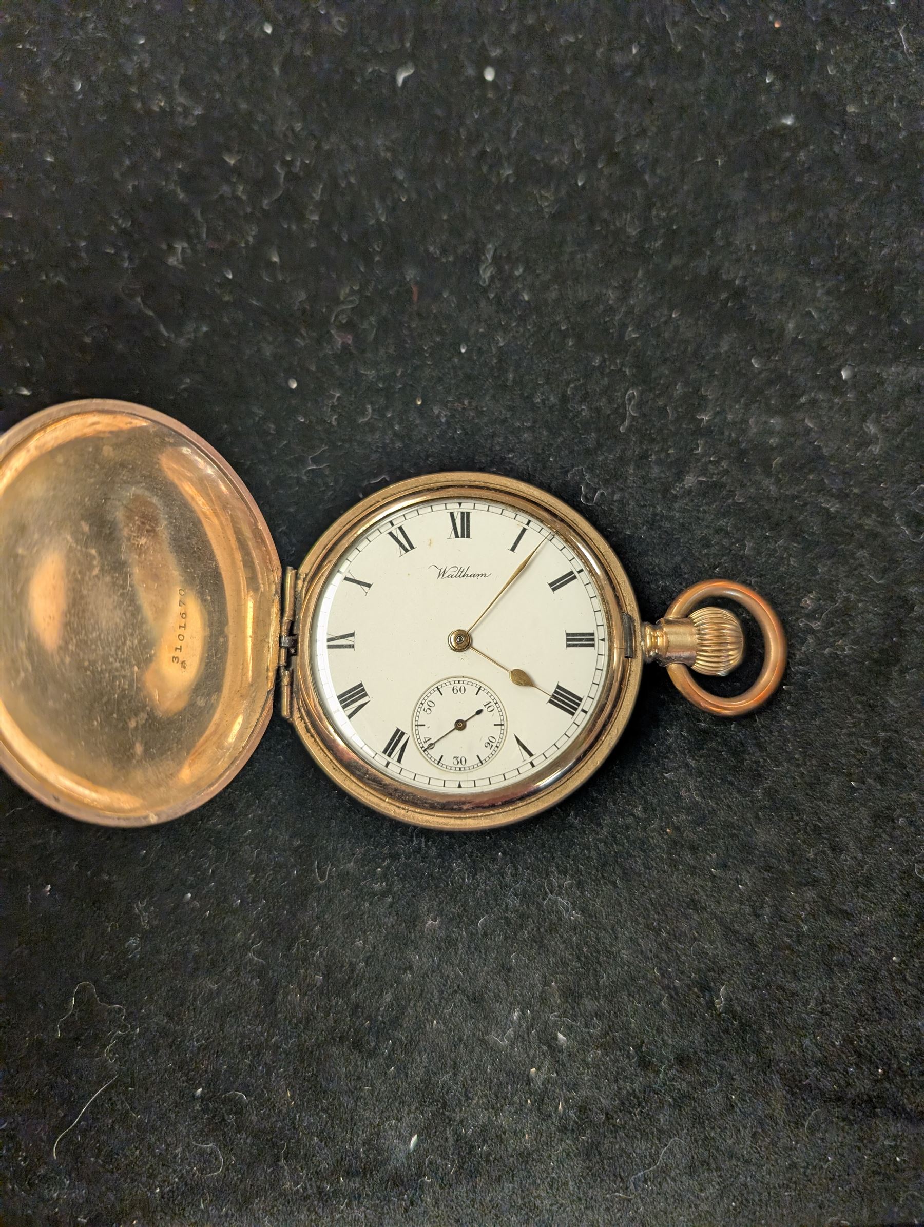 Waltham USA gold plated full hunter pocket watch, the white enamel dial with subsidiary seconds dial, the front cover engraved and embossed with blank cartouche in a floral border, the back cover engraved with stag