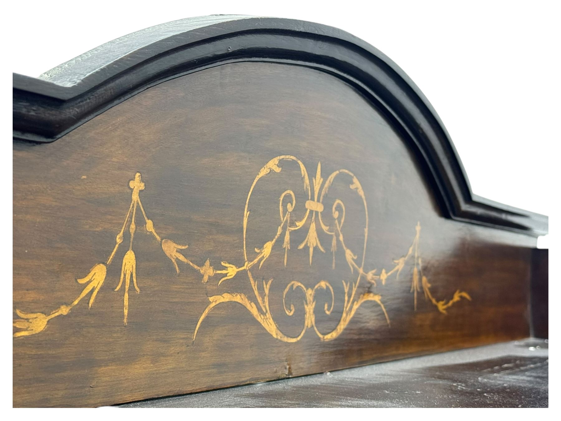 Edwardian mahogany and satinwood crossbanded display cabinet, arched pediment centred by marquetry scrollwork and ribbon decoration, twin glazed doors enclosing a lined a shelved interior, raised on square tapering supports joined by a shaped undertier with diamond parquetry inlay, terminating in spade feet