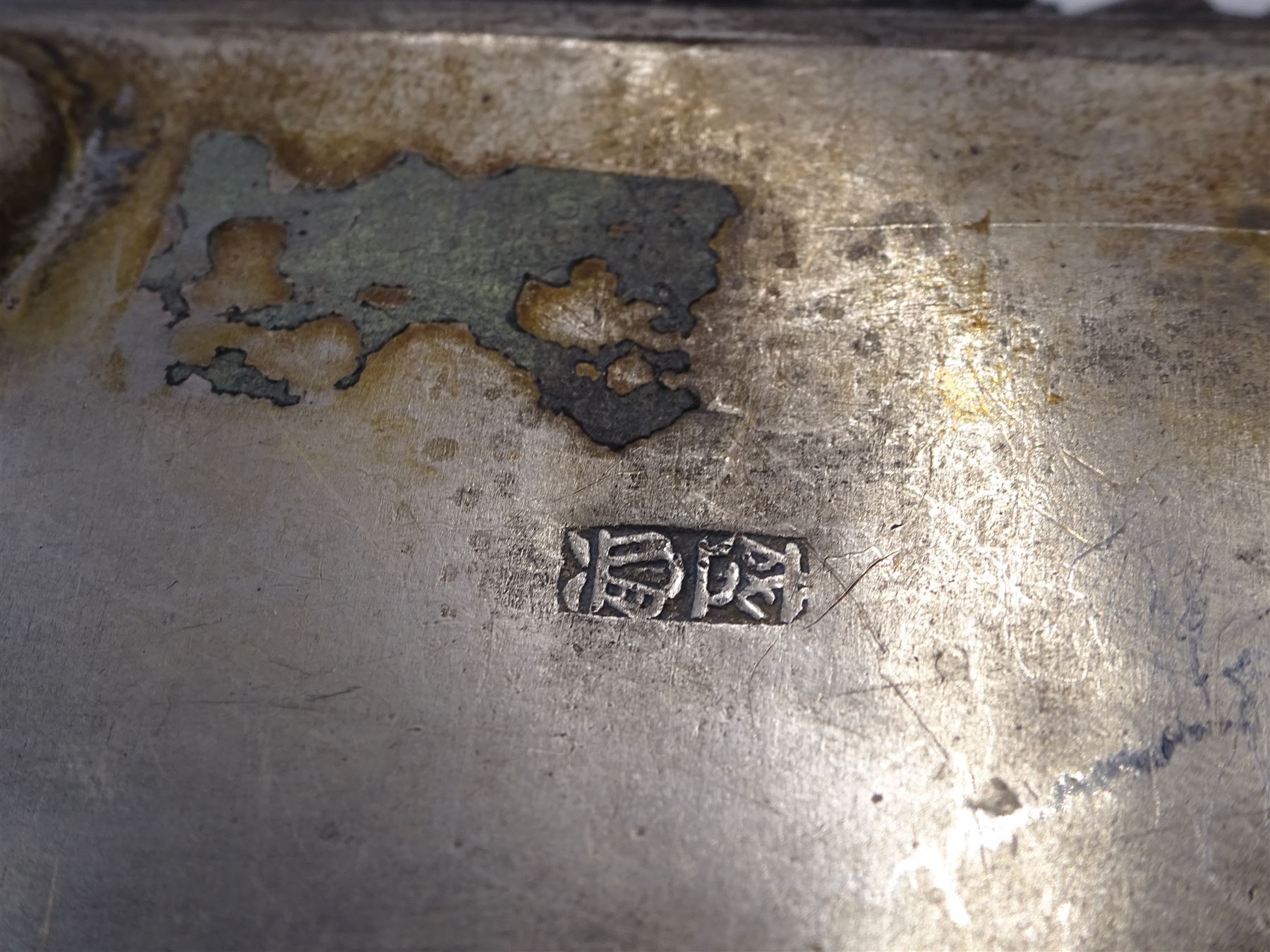 Continental silver bowl, of circular lobed form, repousse decorated with tribal and hunting scenes, upon three claw feet, unmarked but testing as 800 silver, H5cm, together with Chinese silver purse, of domed rectangular form, with ornate repousse decoration, depicting flowers, instruments, birds etc, with lobed wire wrapped handle, with Chinese character marks beneath, testing 650 silver,  including handle H11cm, and two base metal miniature animals