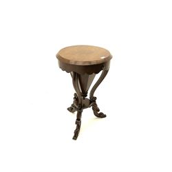 Victorian rosewood work table, circular hinged lid enclosing trumpet shaped body with fitted interior, scroll carved serpentine supports, on tripod base