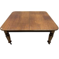 Victorian mahogany dining table, the rectangular top with rounded corners, on turned and lobed supports, brass and ceramic castors (no leaves)