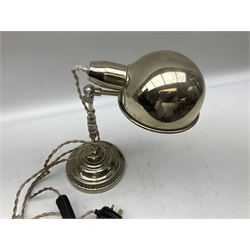 Chrome table lamp with adjustable head, on a circular plinth with relief decoration, untested, H40cm  