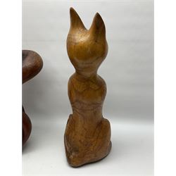 Helen Skelton (British 1933 – 2023): Three carved wooden abstract sculptures, each modelled as a cat, with carved or painted features, largest H63cm. Born into an RAF family in 1933 in Kent and travelled the world extensively during her childhood. After settling in Bridlington, Helen immersed herself in painting, textiles, and wood sculpture, often inspired by nature's beauty. Her talent was showcased in a one-woman show at Sewerby Hall and recognised with the sculpture prize at Ferens Art Gallery in 2000. Sadly, Helen’s daughter passed away from cancer in 2005. This loss inspired Helen to donate her sculptures to Marie Curie upon her passing in 2023.