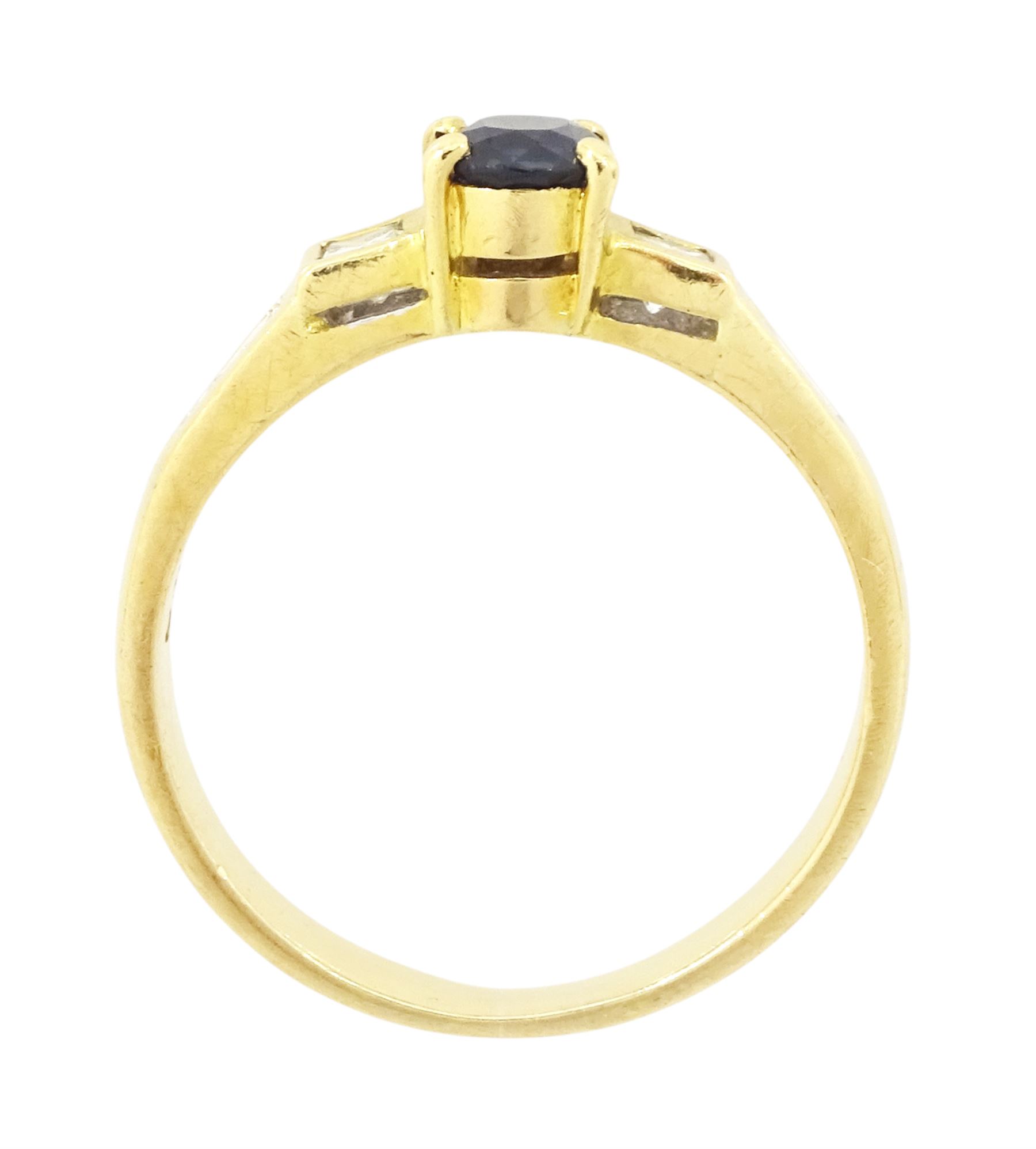 18ct gold sapphire and diamond ring, single oval cut sapphire of approx 0.70 carat, with a princess cut diamond and two round brilliant cut diamonds set either side, stamped 750, total diamond weight approx 0.20 carat