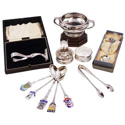 Group of silver, including twin handled trophy, of plain circular form and personal engraving, hallmarked William Neale & Son Ltd, Birmingham 1937, upon wooden base, together with three silver napkin rings, silver pusher, pair of silver sugar tongs and a collection of silver and enamel souvenir spoons, all hallmarked 