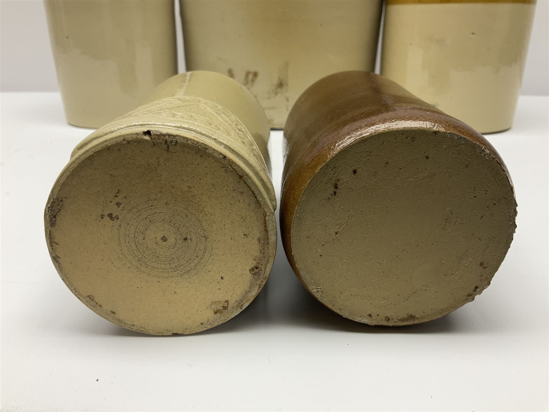 Large 2 gallon stoneware flagon, stamped 'John Soulby Wine Merchant Malton 2 Gall', together with a collection of similar stoneware jars and bottles, largest H40.5cm