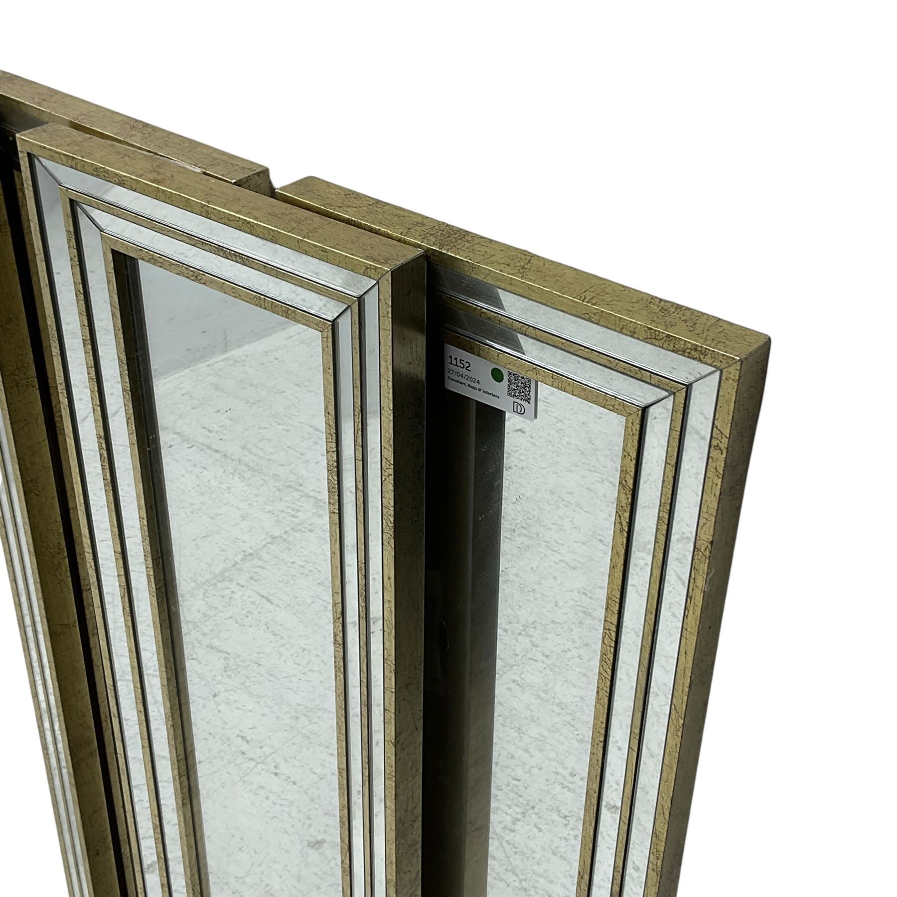 Six narrow rectangular wall mirrors