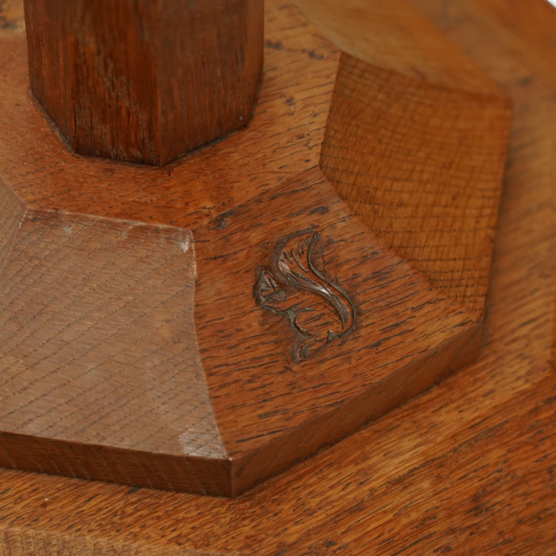 Squirrelman - oak standard lamp, the octagonal stepped base carved with the signature squirrel, the tapering octagonal column rising to a brass fitting, by Wilfrid Hutchinson, Husthwaite