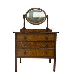 Early 20th century oak dressing chest, raised back with oval swing mirror and bevelled plate, fitted with three drawers