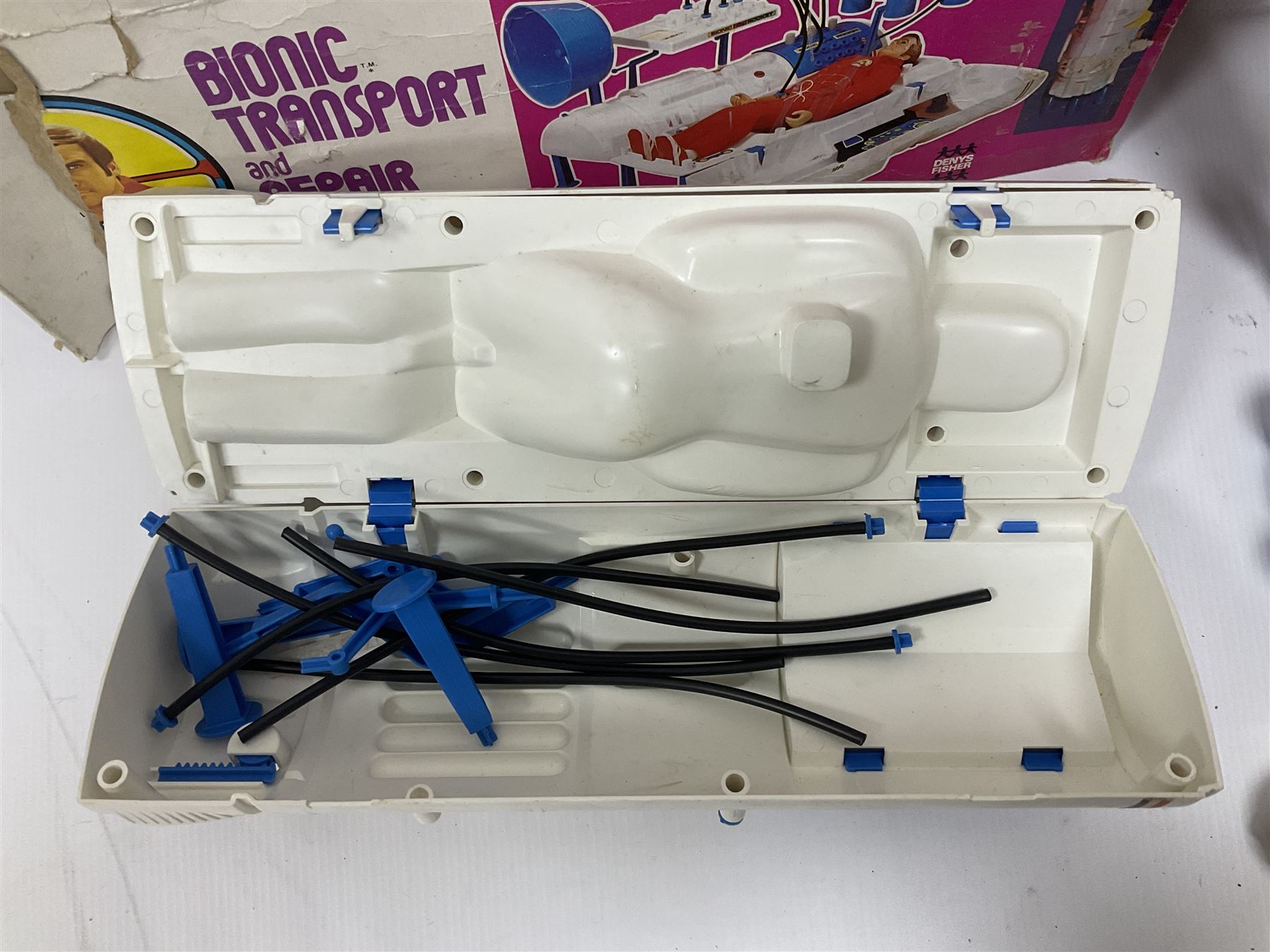 Six Million Dollar Man - two 1975 Bionic Transport and Repair Stations with related figures, further accessories and boxes