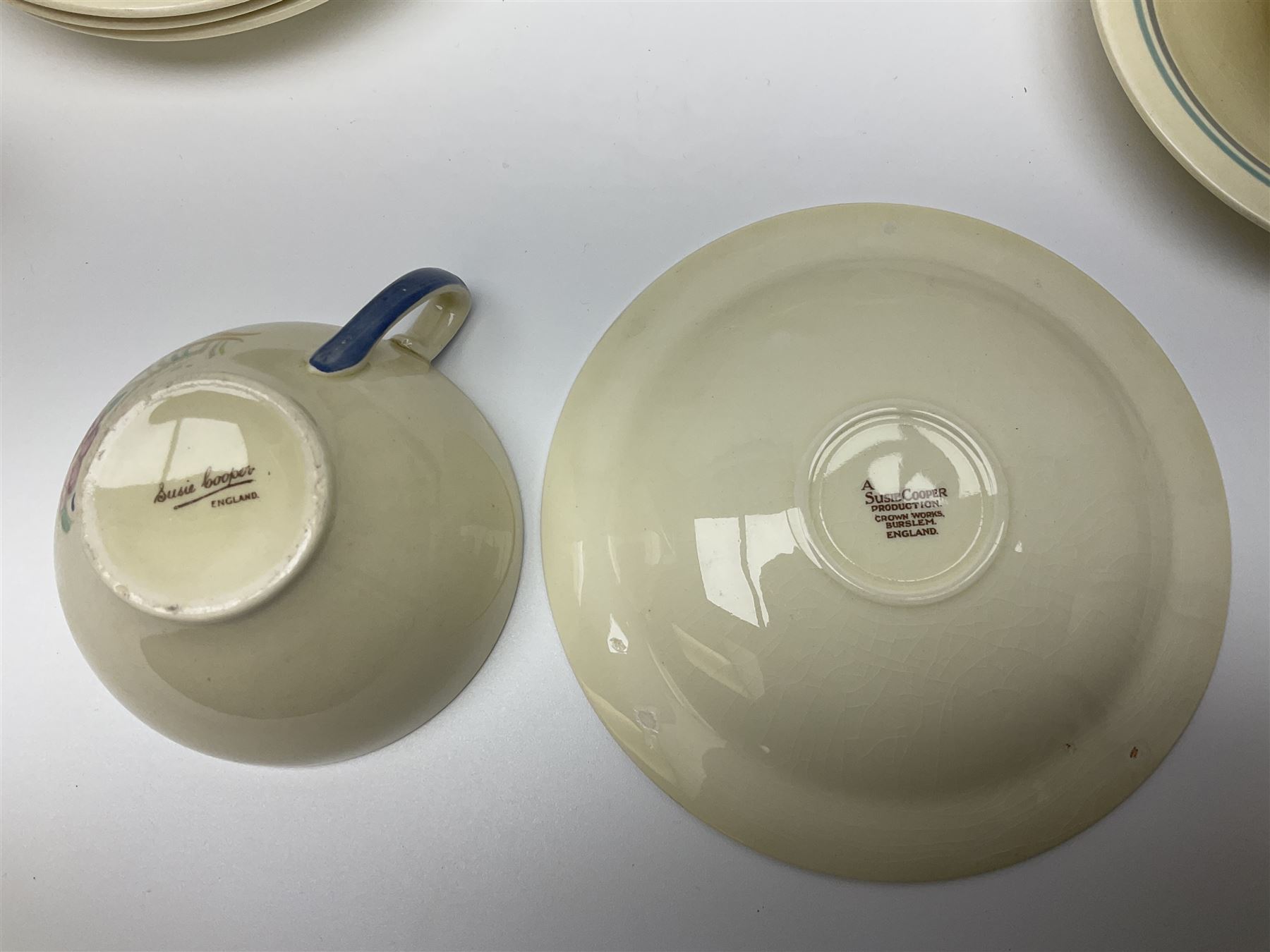 Susie Cooper Nosegay pattern tea service, teapot, eight cups and saucers, six dessert plates, three graduating jugs, covered twin handled sucrier, open sucrier  and cake plate 