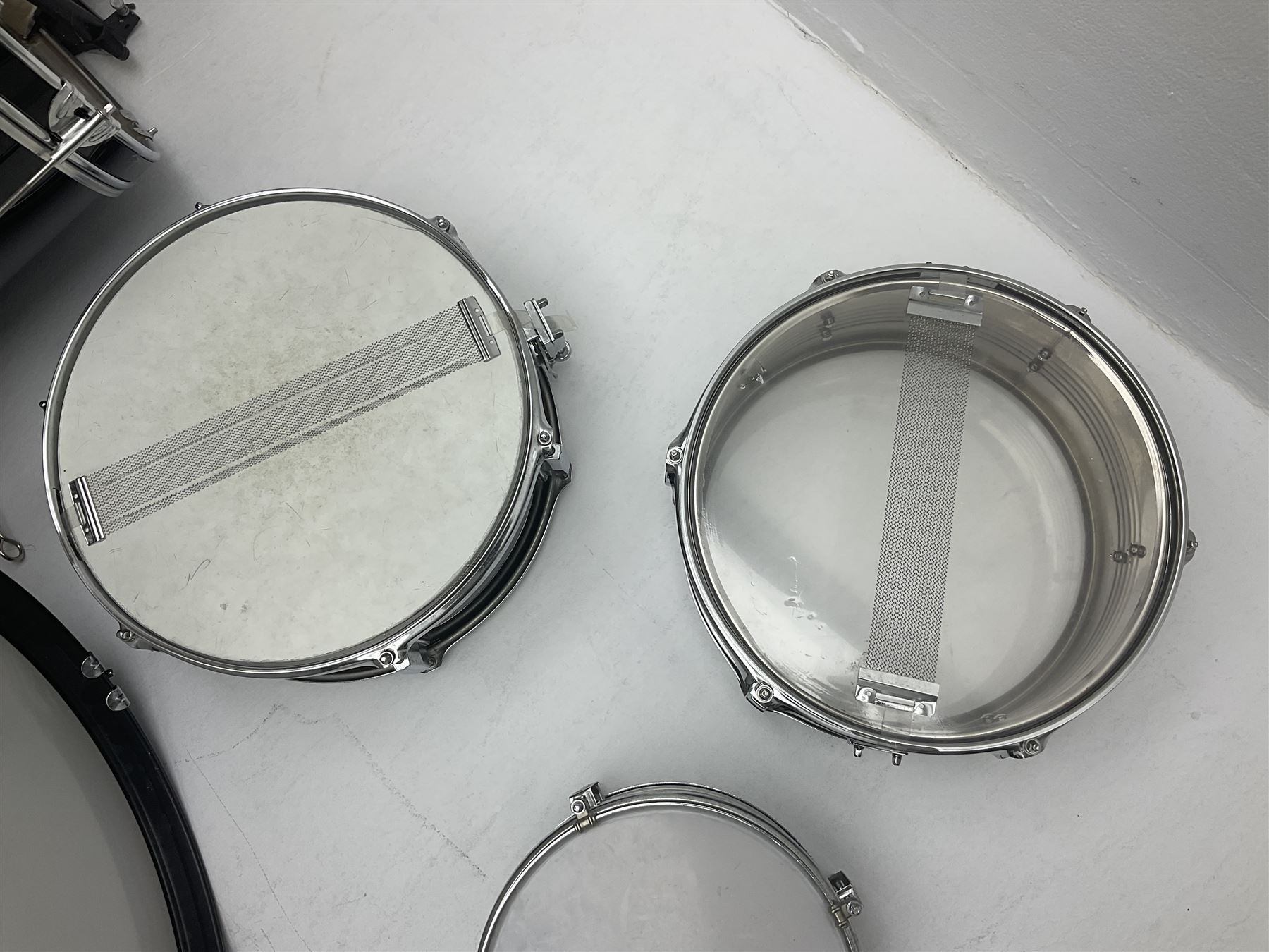 Rockburn eight-piece black drum kit with bass drum, floor tom and five other toms and snare drum; together with two other snare drums; Haosen bass drum; four cymbals; various stands, foot pedals, stool, tri-angle, drum sticks etc