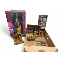 Collection of Disney and similar figures and memorabilia, including Pirates of the Caribbe...