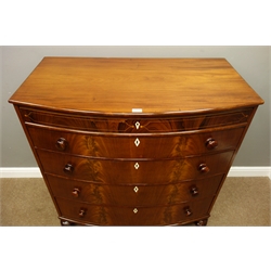  Early 19th Century figured mahogany bow front chest of four drawers, with rosewood faux frieze, turned handles and feet, W109cm, H112cm, D58cm  