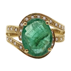 Gold oval emerald ring with diamond swir