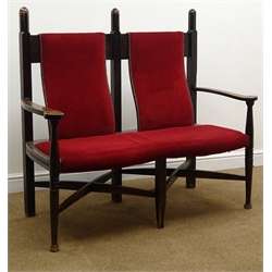  Arts & Crafts elm framed double back settee, upholstered back and seat in a red fabric, turned supports joined by an 'X' framed stretcher, W125cm  