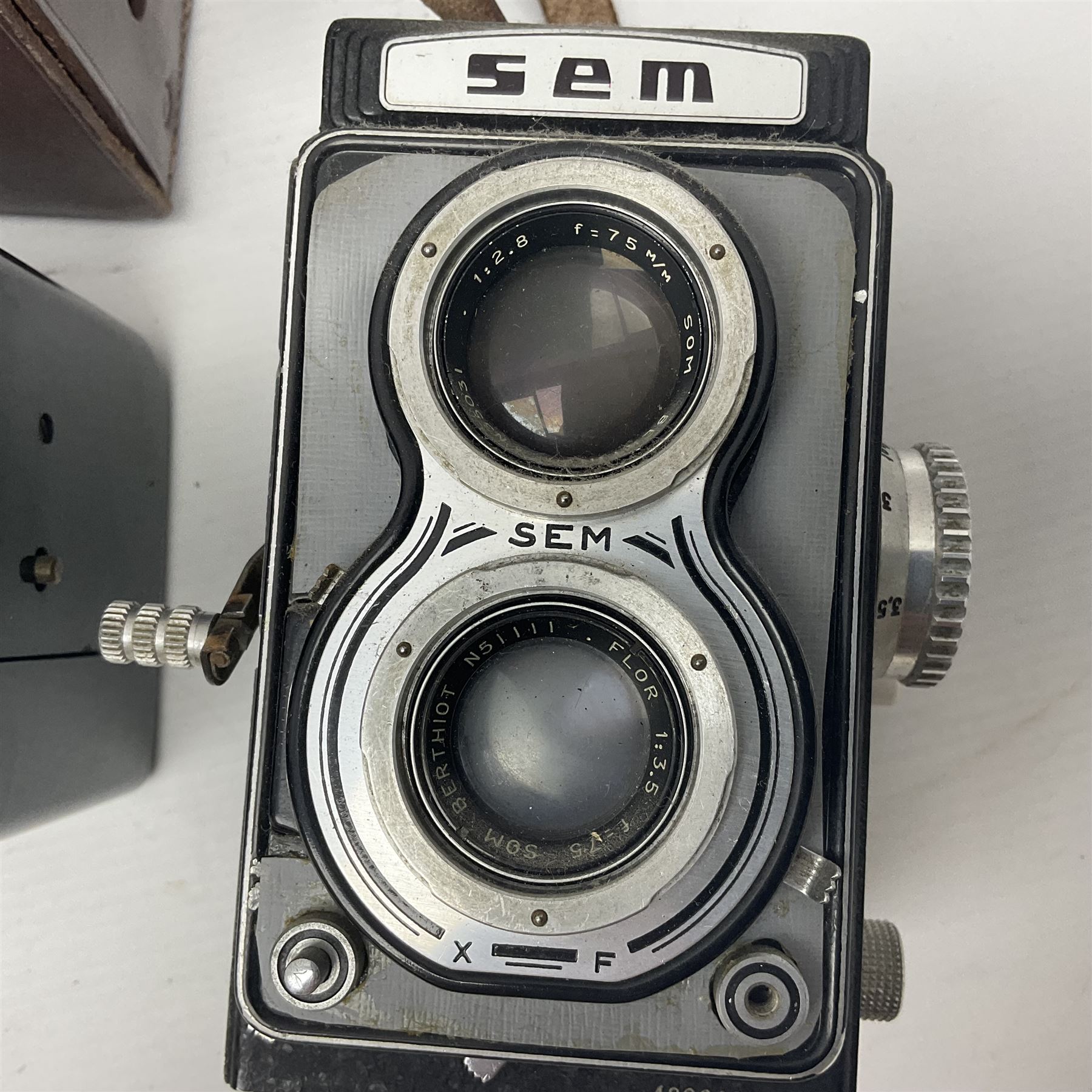 Franke & Heidecke Rolleicord twin lens camera, serial number 012706 with Heidoscop-Anastigmat f=7.5cm' lens and a 'Carl Zeiss Jena Triotar 1:4.5 f=7.5cm' lens, serial no 1474898, together with three similar cameras, including SEM TLR, serial no 420218, Ising Pucky box and Ferrania Elioflex, three in leather carry cases