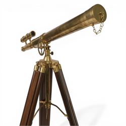 Reproduction brass marine telescope, on wooden tripod stand, inscribed Marine Telescope, London 1915, height on stand H95cm