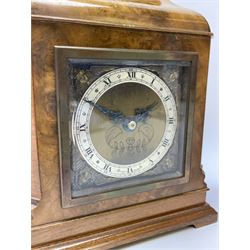 Mid to late 20th century walnut cased mantel clock by 'Elliot' (W17cm, H20cm), and an Edwardian inlaid mahogany lancet shaped mantel clock (W16cm, H22cm)