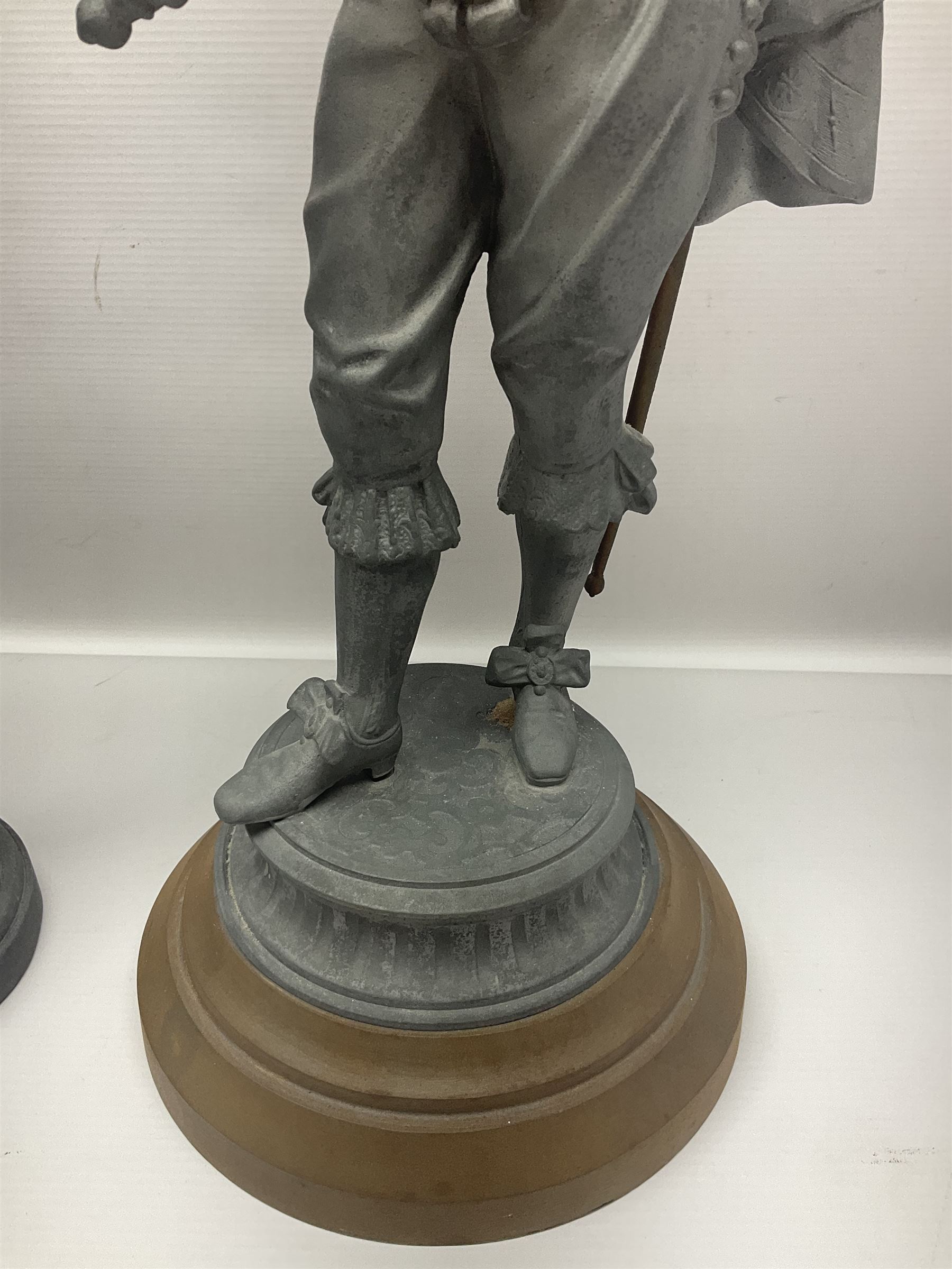 Pair of spelter figures modeled as Cavaliers, together with a spelter figure of Joan of Arc, largest H52cm