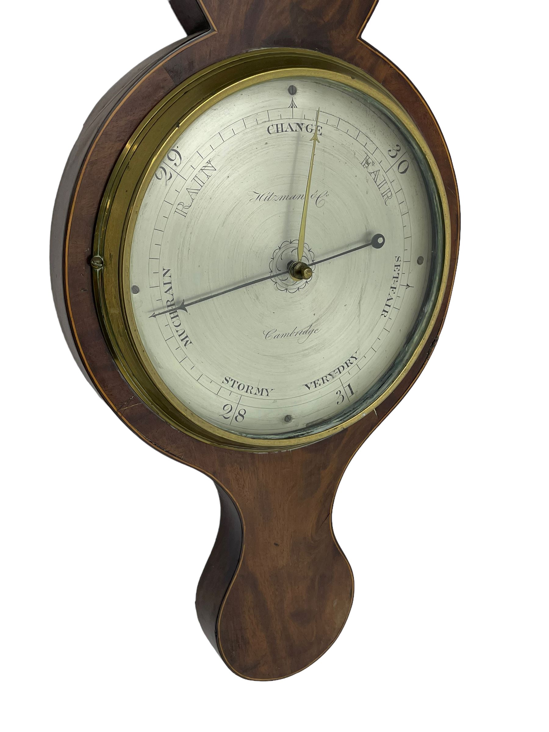 Hitzman & Co of Cambridge - Early 19th century mahogany mercury wheel barometer c1830,
With a broken pediment and finial, rounded base, and lined stringing to the edge, cast brass bezel with an 8-inch circular silvered register calibrated in inches and signed Hitzman & Co, Cambridge, with brass setting pointer to the glass, beneath an arched 12” Fahrenheit scale spirit thermometer with a silvered register. Joseph and Henry Heitzman were German barometer makers and clock importers who lived and worked in Trinity Street Cambridge 1820-1900, often found as here spelt Hitzman.
