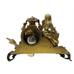 French-Gilt-metal mantle clock c1870, with a seated figure of a lady holding a pair of scales, on a scroll base with a porcelain panel on a blue ground depicting a floral spray of flowers, with brass castings of fruit and foliate decoration, enamel dial signed Henry Marc, Paris, with Roman numerals and steel moon hands, twin train countwheel striking movement sounding the hours and half-hours on a bell. With pendulum and key.