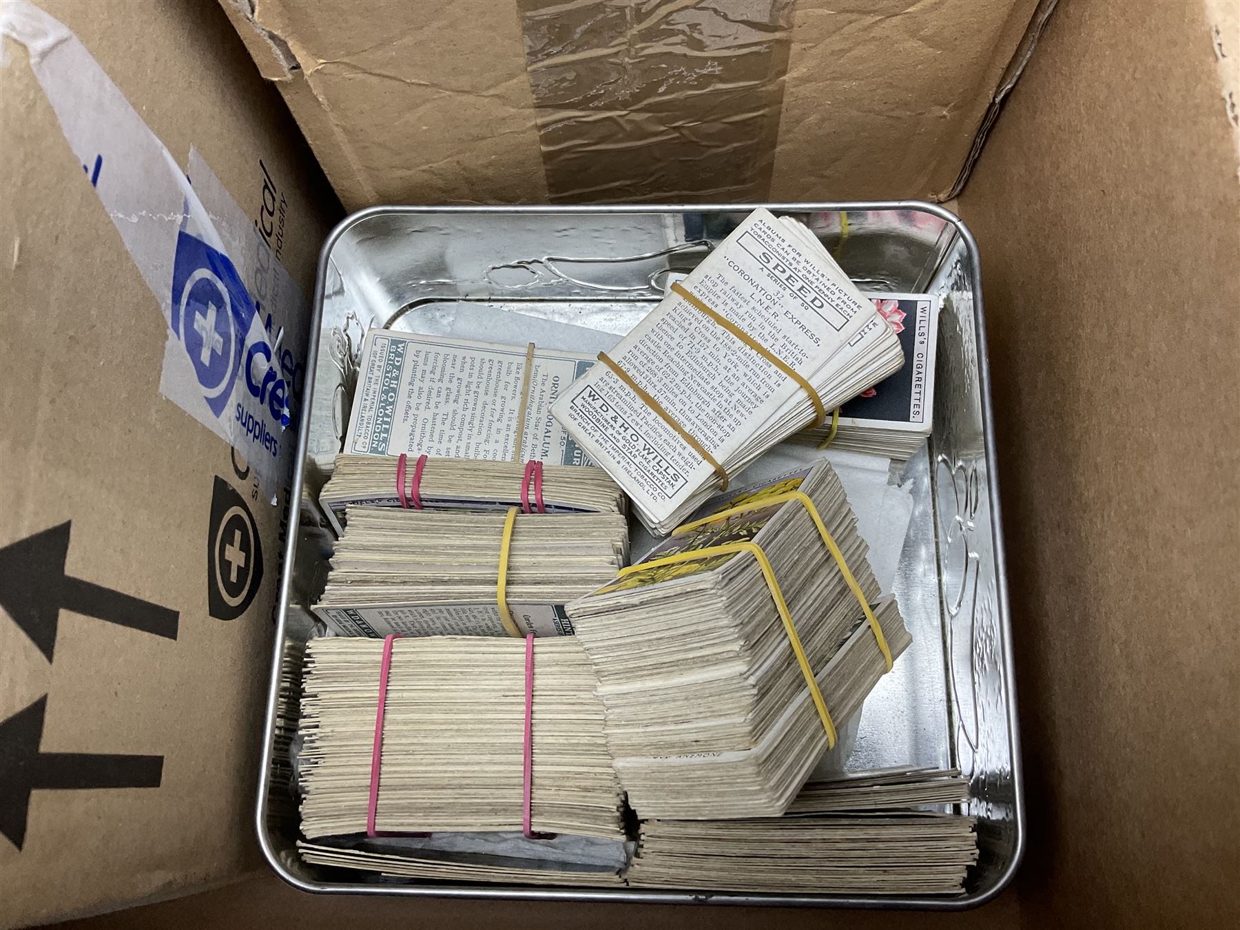 Quantity of cigarette and trade cards, housed in albums and loose, by W.D. & H.O. Wills, John Player & Sons etc, including cycling, garden hints, Britain's railways, dogs etc and various empty vintage cigarette card albums, in two boxes